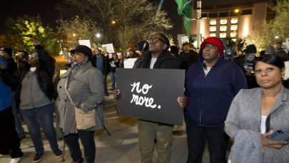 People gather outside the Tarrant County Courthouse to protest a white officer wrestling Jacqueline Craig, a black woman, to the ground, which was captured on video on Dec. 22, 2016.