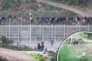video migrants storm spanish enclave over border fence ceuta 